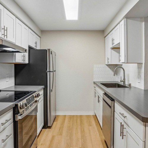 galley kitchen with ample lighting
