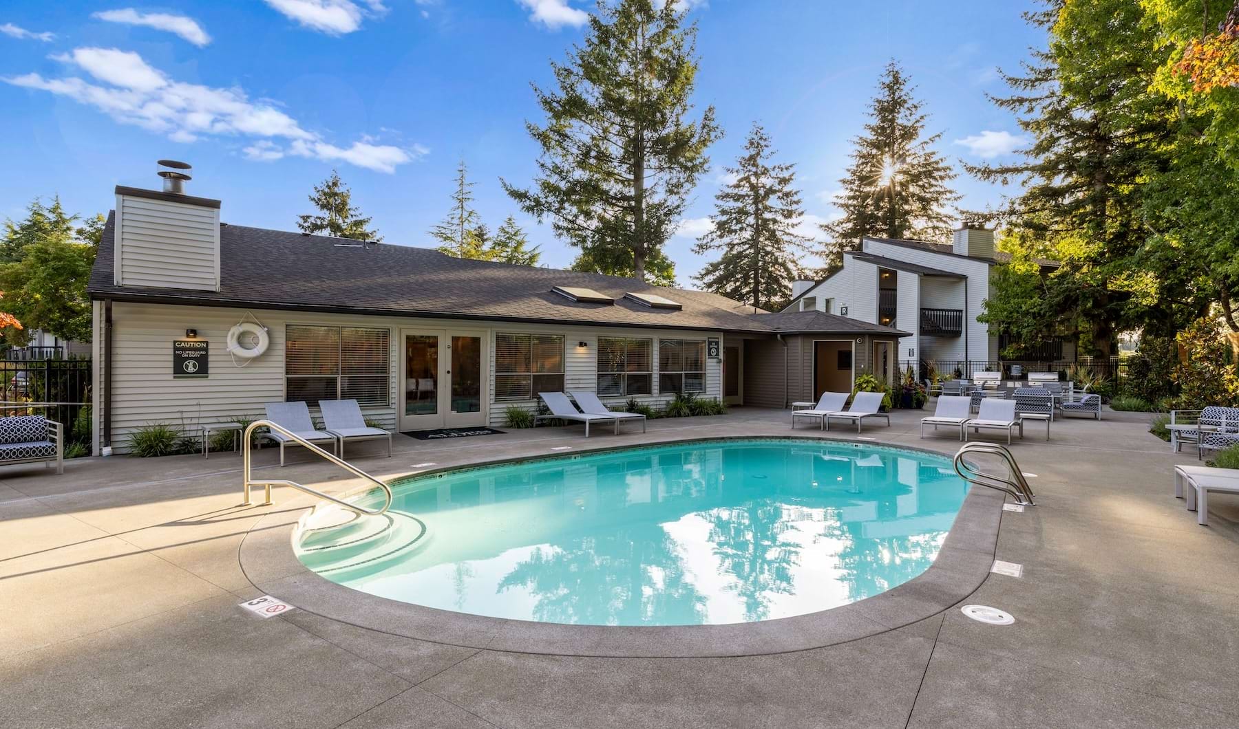 a swimming pool in front of a building