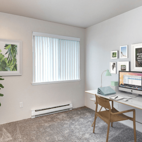 a room with a desk and a window