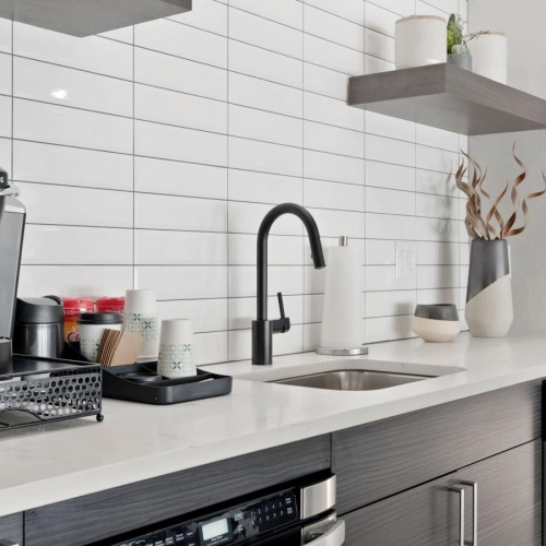 a kitchen with a stove and a sink